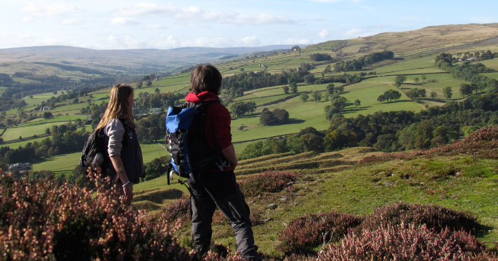 Two walkers stood admiring the countryside views of County Durham and North Pennines.